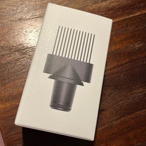 Brand new never used Dyson wide tooth comb (for blowdryer).